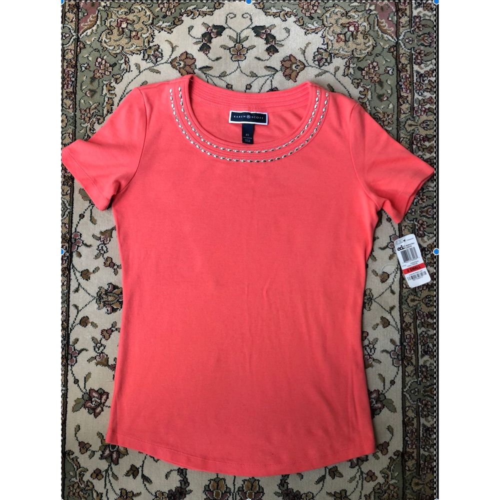 orange top , short sleeve
